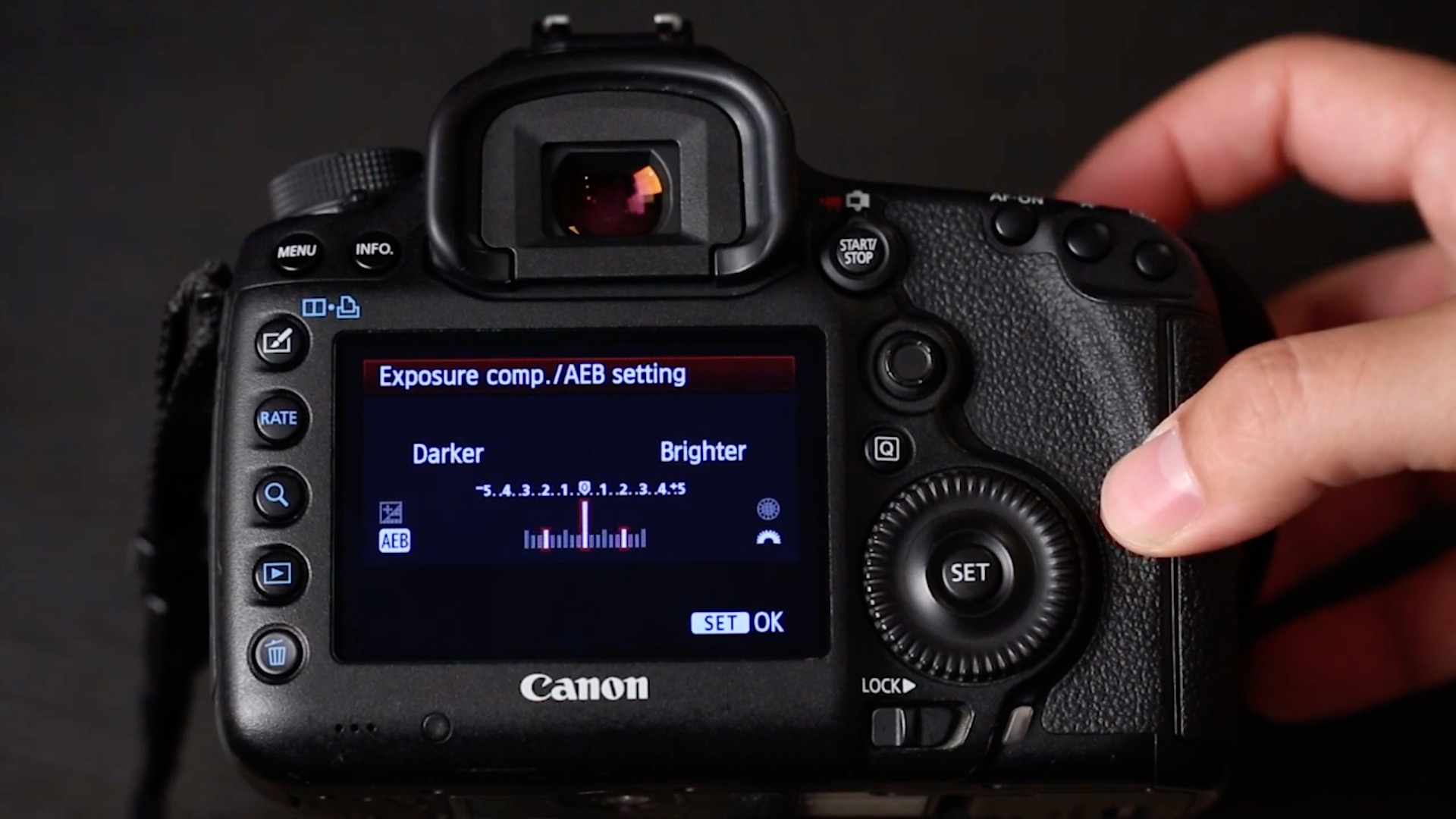 Camera LCD showing an Auto Exposure Bracketing sequence set up on a Canon DSLR with three frames at different exposure values