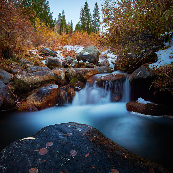 Waterfall landscape photograph using a slow shutter speed and ND filter to create silky water blur effect
