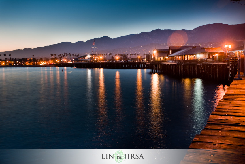 Long exposure photograph of Stearns Wharf Santa Barbara showing glassy silky smooth ocean water achieved with slow shutter speed on a tripod