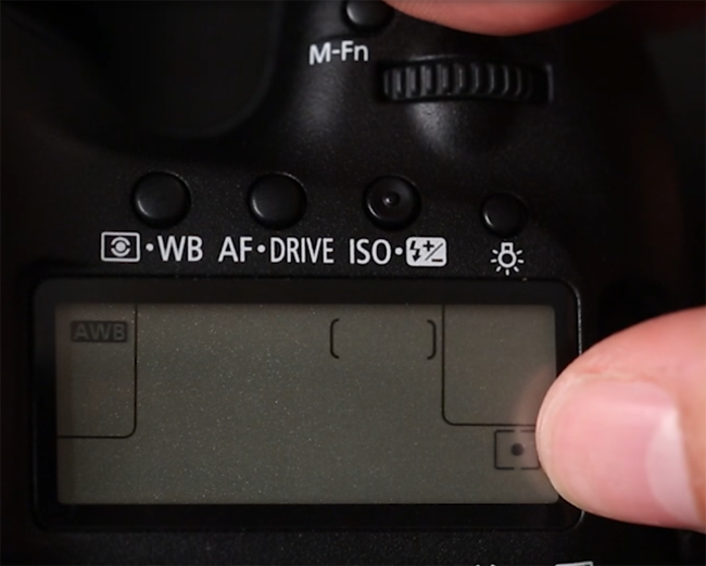 Canon 5D Mark III top LCD showing Spot metering mode icon selected at the bottom right corner of the camera display